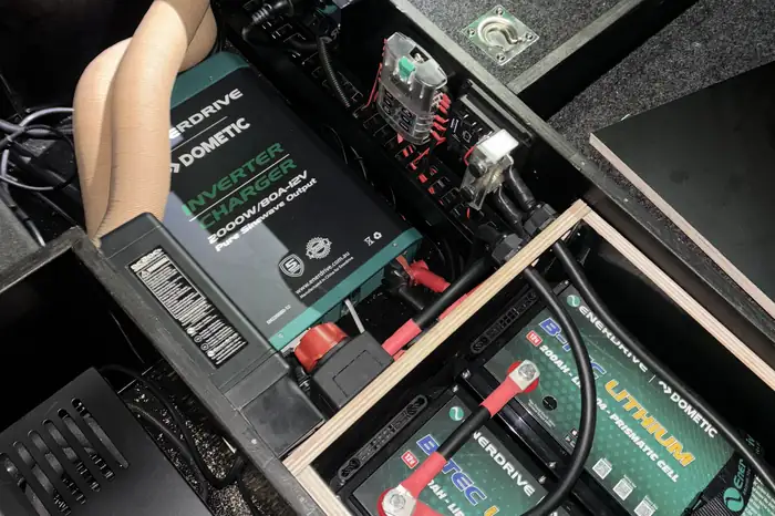 Enerdrive inverter charger and two lithium batteries installed under a vehicle drawer system